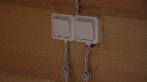 How to conduct electrical wiring in a wooden house according to the PUE and other standards