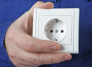 Why does the outlet spark when turning on the appliance?