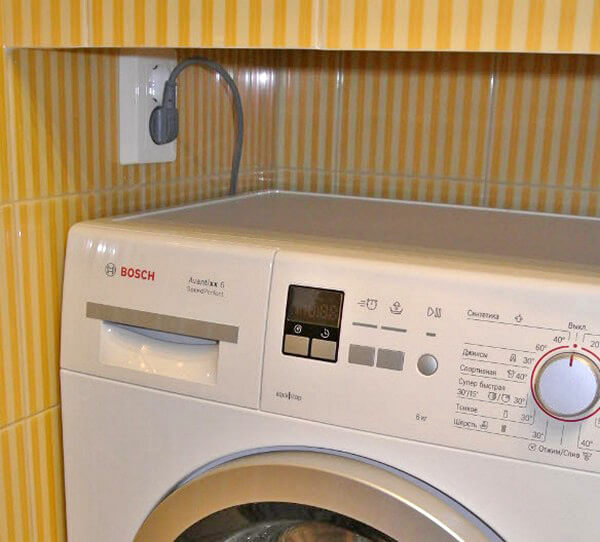Photo of connecting a washing machine in a bathroom
