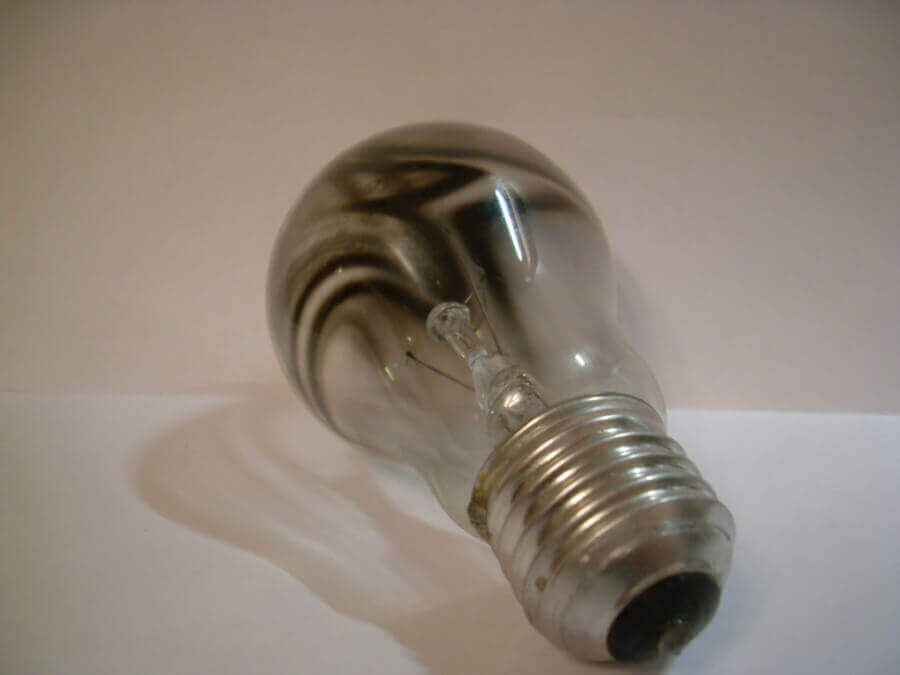 Burnt lamp with traces of tungsten oxide on the bulb