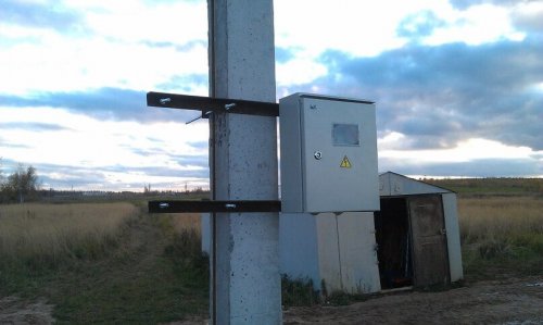 Option for attaching an electrical panel to a pole